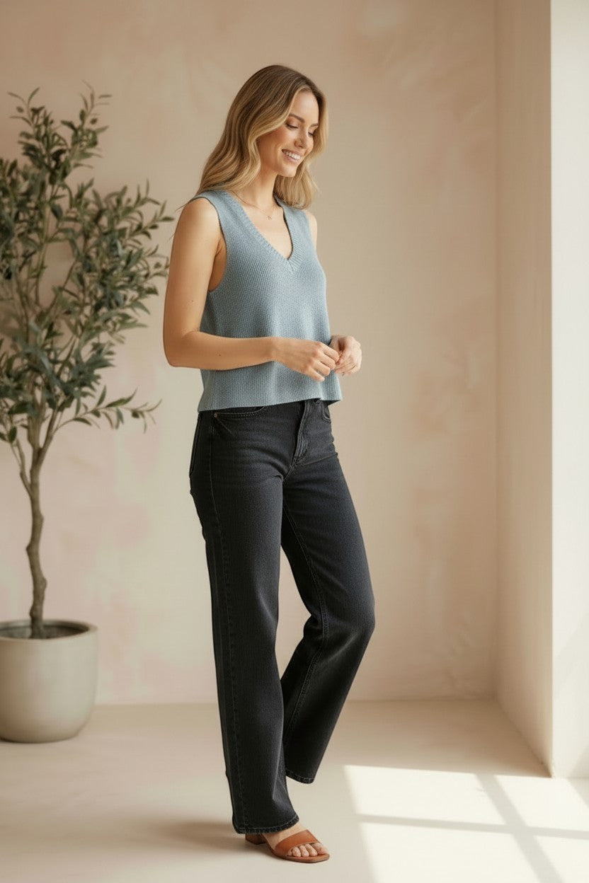 Be Cool knit V-neck tank top in denim, displayed on a model, featuring a fitted sleeveless design with a V neckline.