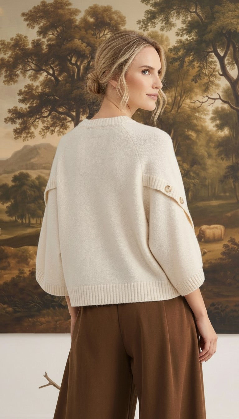 graced The Layla cream knit top with button-detailed sleeves worn by a model in a relaxed fit