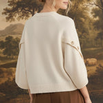 graced The Layla cream knit top with button-detailed sleeves worn by a model in a relaxed fit