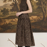 graced Leah sleeveless midi dress in leopard print with smocked waist and ruffled neckline worn by a blonde model
