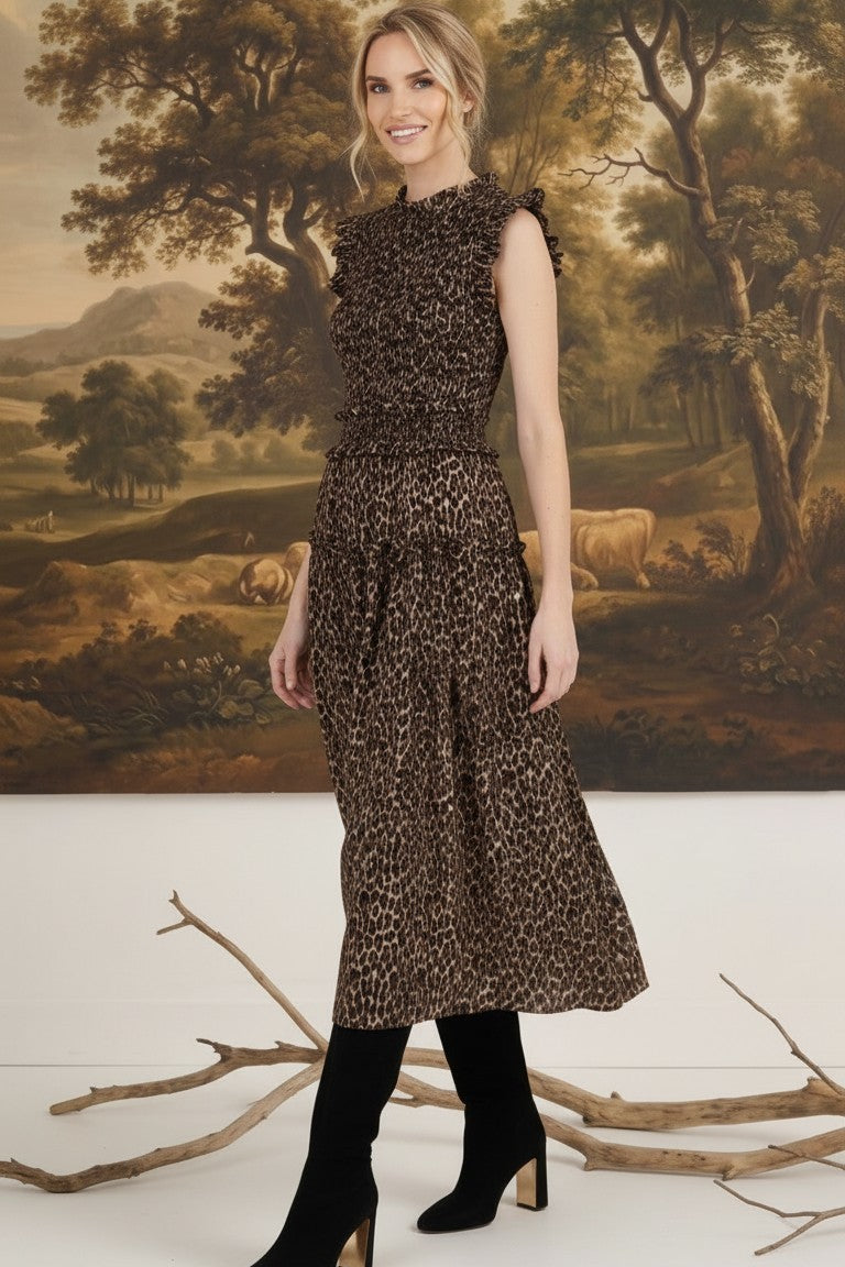 graced Leah sleeveless midi dress in leopard print with a smocked bodice and ruffled shoulders on a model