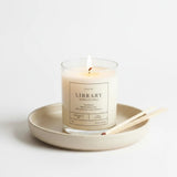 Graced library scented soy wax candle in a clear glass tumbler, designed for home fragrance and ambiance.