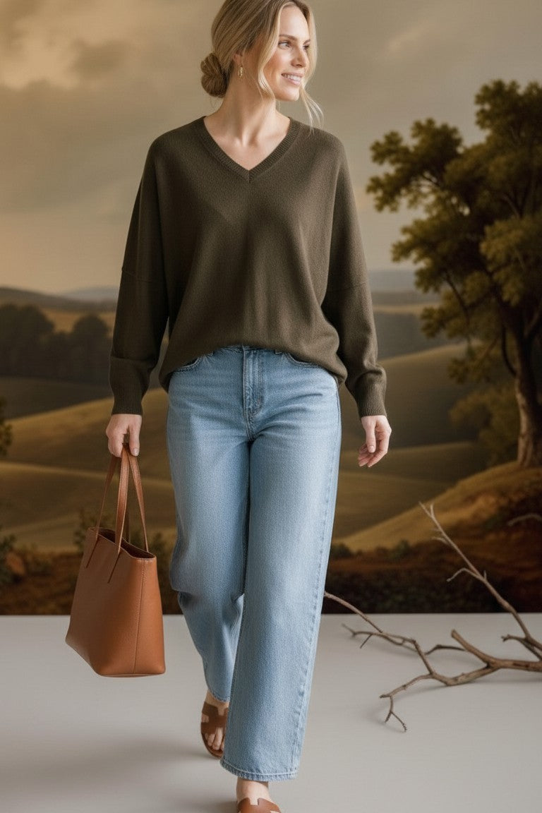 graced Lyn espresso V-neck sweater with batwing sleeves worn by a woman with light blue jeans and a brown tote bag