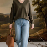 graced Lyn espresso V-neck sweater with batwing sleeves worn by a woman with light blue jeans and a brown tote bag