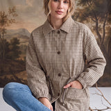 graced The Macy Mock Neck Jacket in a tan and brown gingham print with a button-front closure and drawstring waist
