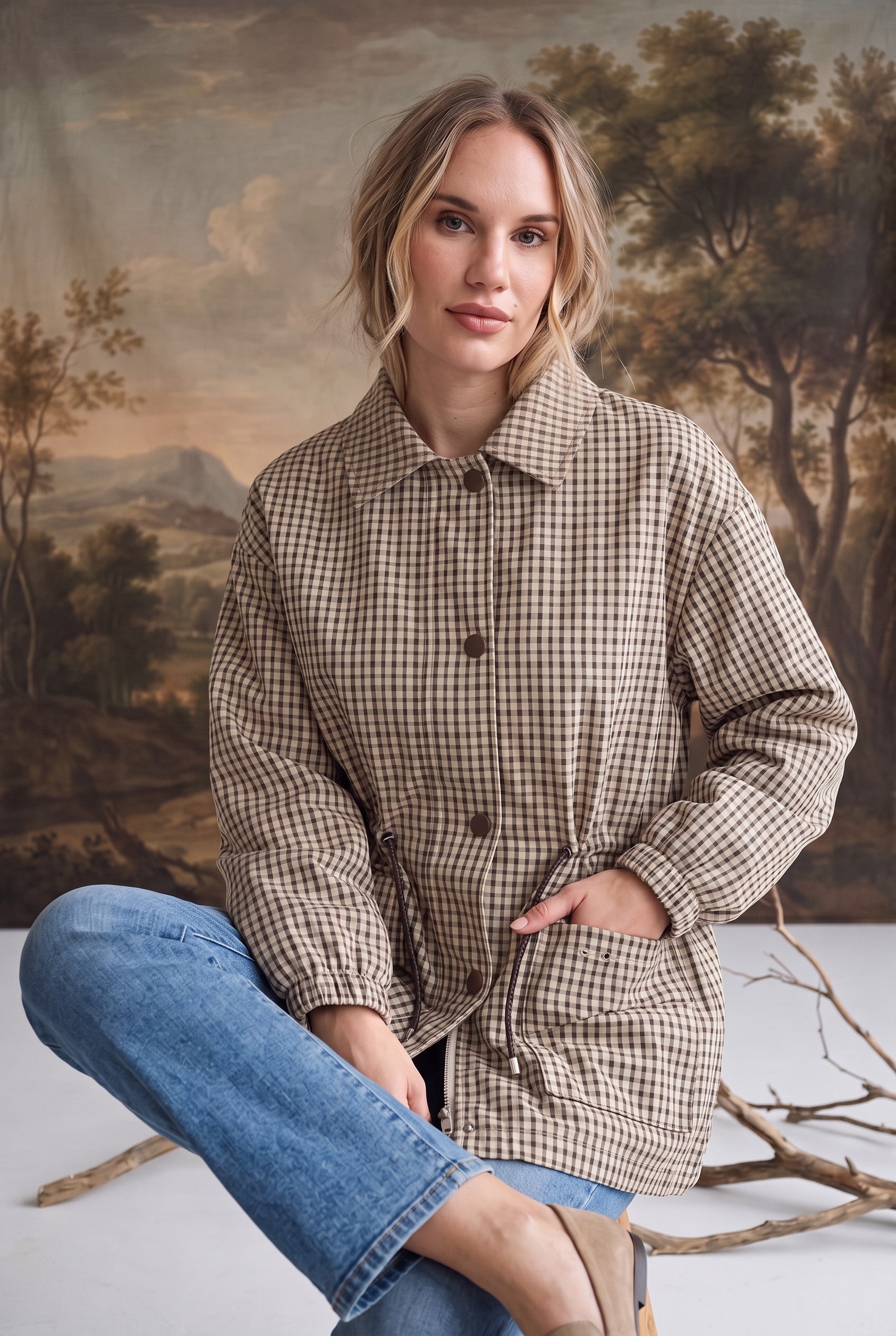 graced The Macy Mock Neck Jacket in a tan and brown gingham print with a button-front closure and drawstring waist