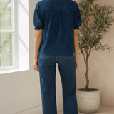 Navy puff sleeve split neck blouse from Lovestitch, featuring a stylish design with puffed sleeves and a split neckline.