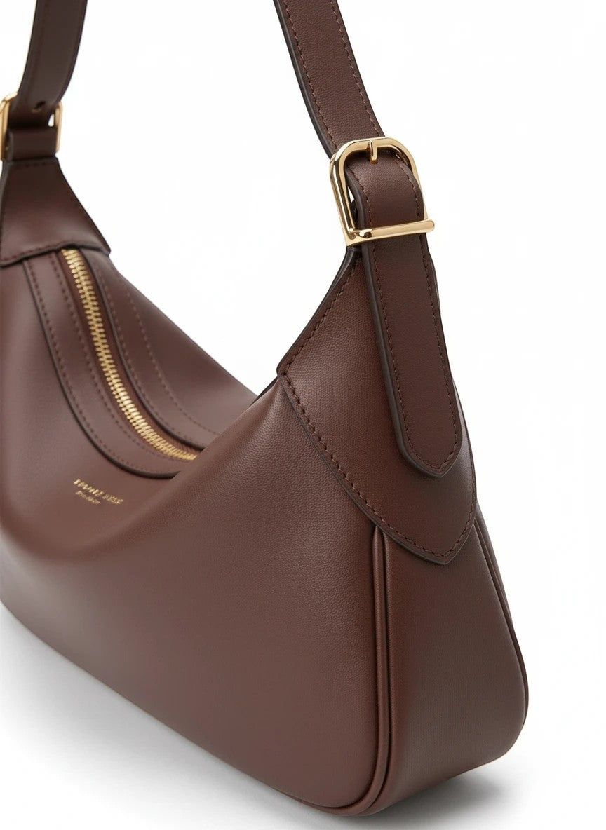 Melie Bianco Nicolette shoulder bag in espresso leather with gold-tone hardware and adjustable shoulder strap.