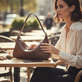 Melie Bianco Nicolette shoulder bag in espresso leather with sleek strap and minimalist design for stylish accessories.
