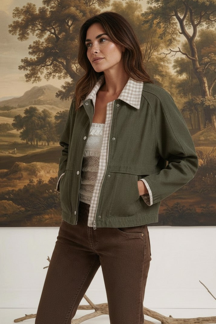 graced Paula canvas twill jacket in olive green with a gingham collar, worn by a model in a studio setting.