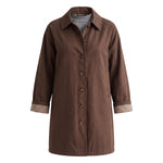graced The Raven midi trench coat in brown with a classic collar, button front, and plaid cuff lining details.