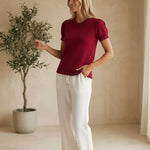Red Camellia knit top with scallop trim and puff sleeves, featuring a stylish, feminine design.