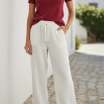 Red knit puff sleeve top with scallop trim from Camellia featuring a stylish, feminine design.