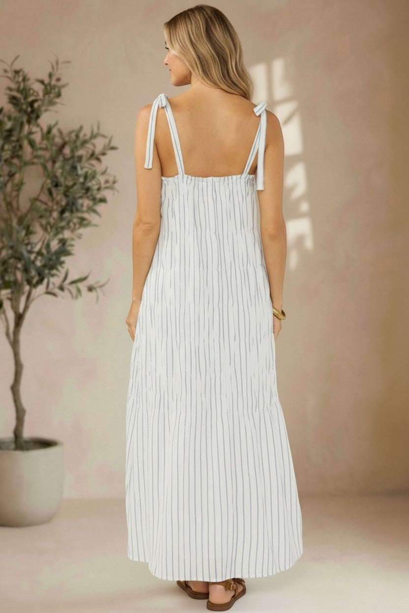Lovestitch shirred tie-shoulder maxi dress with flowing fabric and elegant design, perfect for summer or casual wear.