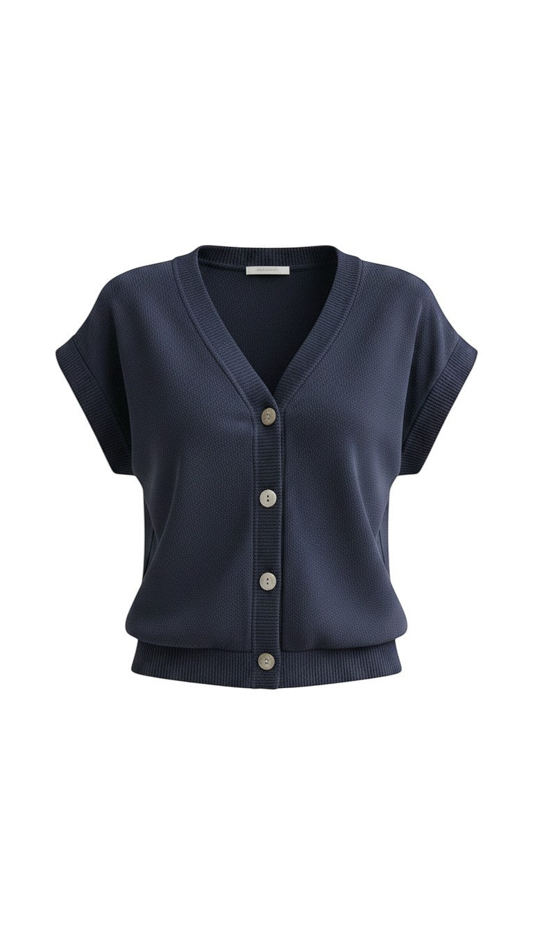 Navy sleeveless button-down top from in february, casual basic top with a collared neckline and front buttons.