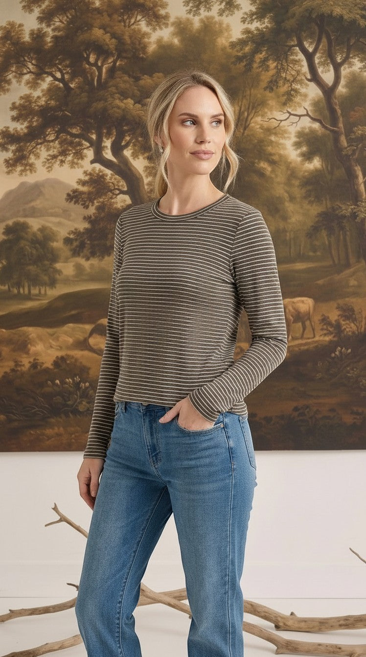 graced long sleeve top in olive green with white horizontal stripes worn by a woman with blue jeans