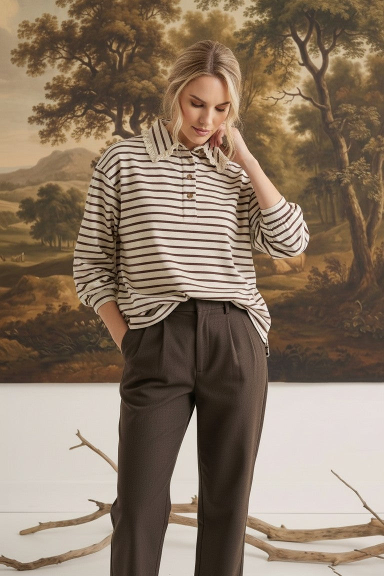 graced Tracy striped polo top with lace collar detail worn by a model in a studio setting