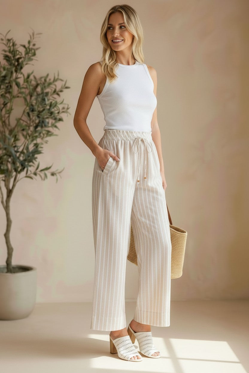 Allie Rose striped smock waist pants featuring a relaxed fit with vertical multicolor stripes and a comfortable, stylish design.