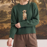 graced The Sydney Retriever Sweater in forest green with a golden retriever knit design worn by a blonde model
