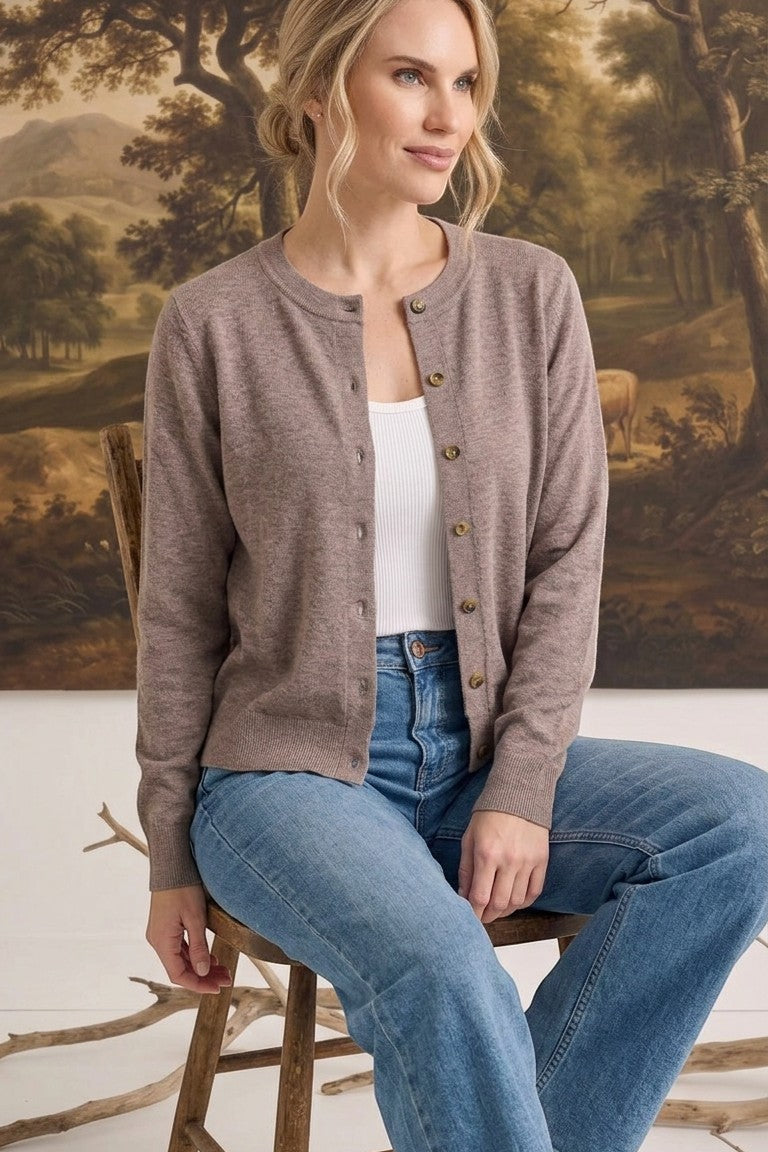 graced crew neck button down cardigan in a soft taupe knit worn by a woman with blue jeans