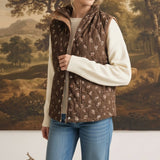 graced The Teagan Quilted Vest in brown floral cotton worn over a cream sweater and blue jeans