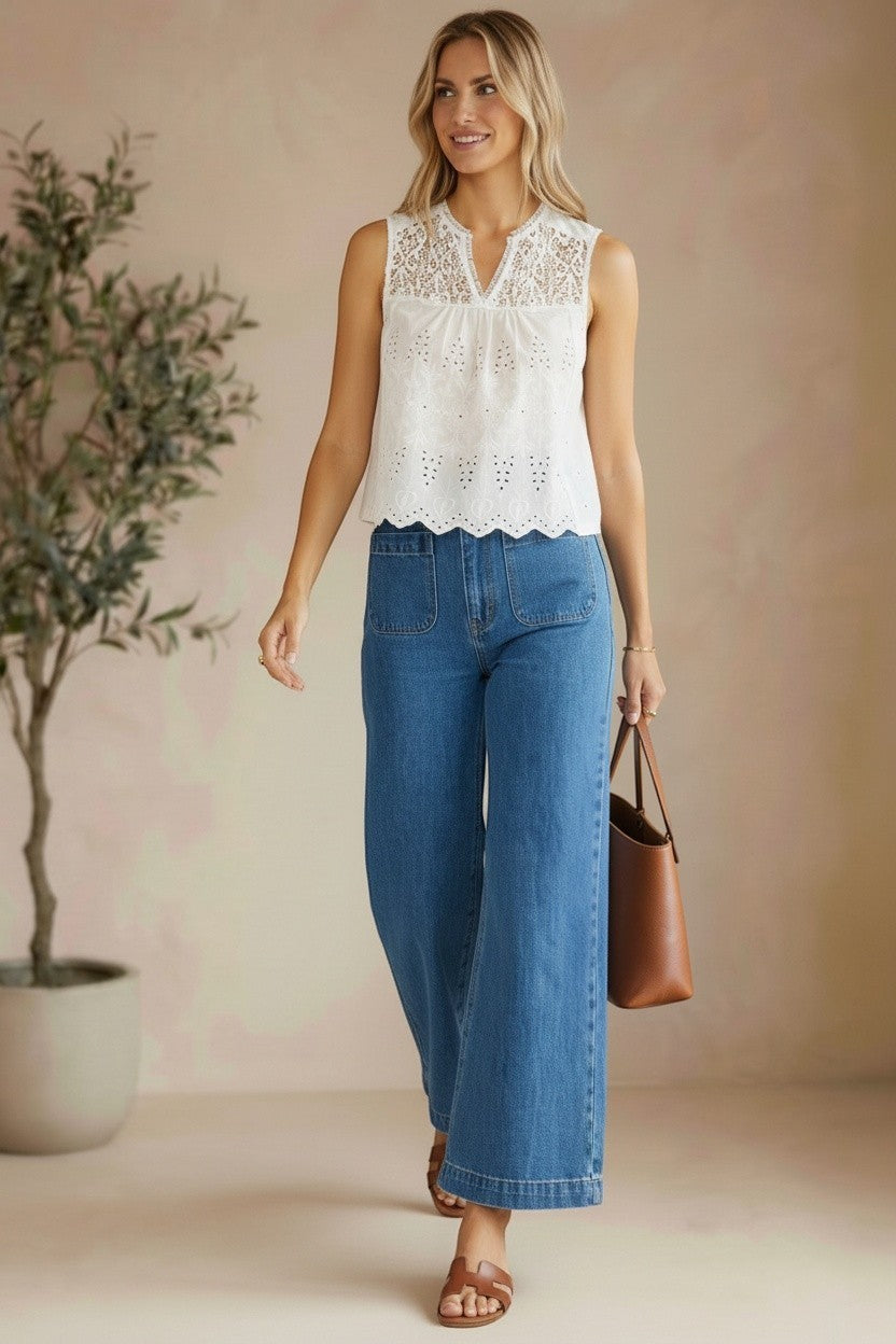 White sleeveless eyelet lace tank top by Lovestitch, featuring breathable cotton fabric and delicate eyelet detailing.
