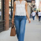 White sleeveless eyelet lace tank top by Lovestitch, featuring delicate lace details and a relaxed fit.