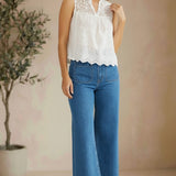White sleeveless eyelet lace tank top by Lovestitch, featuring intricate eyelet details and a relaxed fit.
