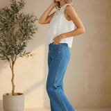 White sleeveless eyelet lace tank top by Lovestitch with delicate eyelet detailing and a relaxed fit.