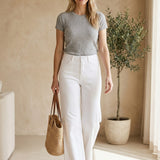 Graced white high rise wide leg jeans made from cotton blend with a flattering fit.