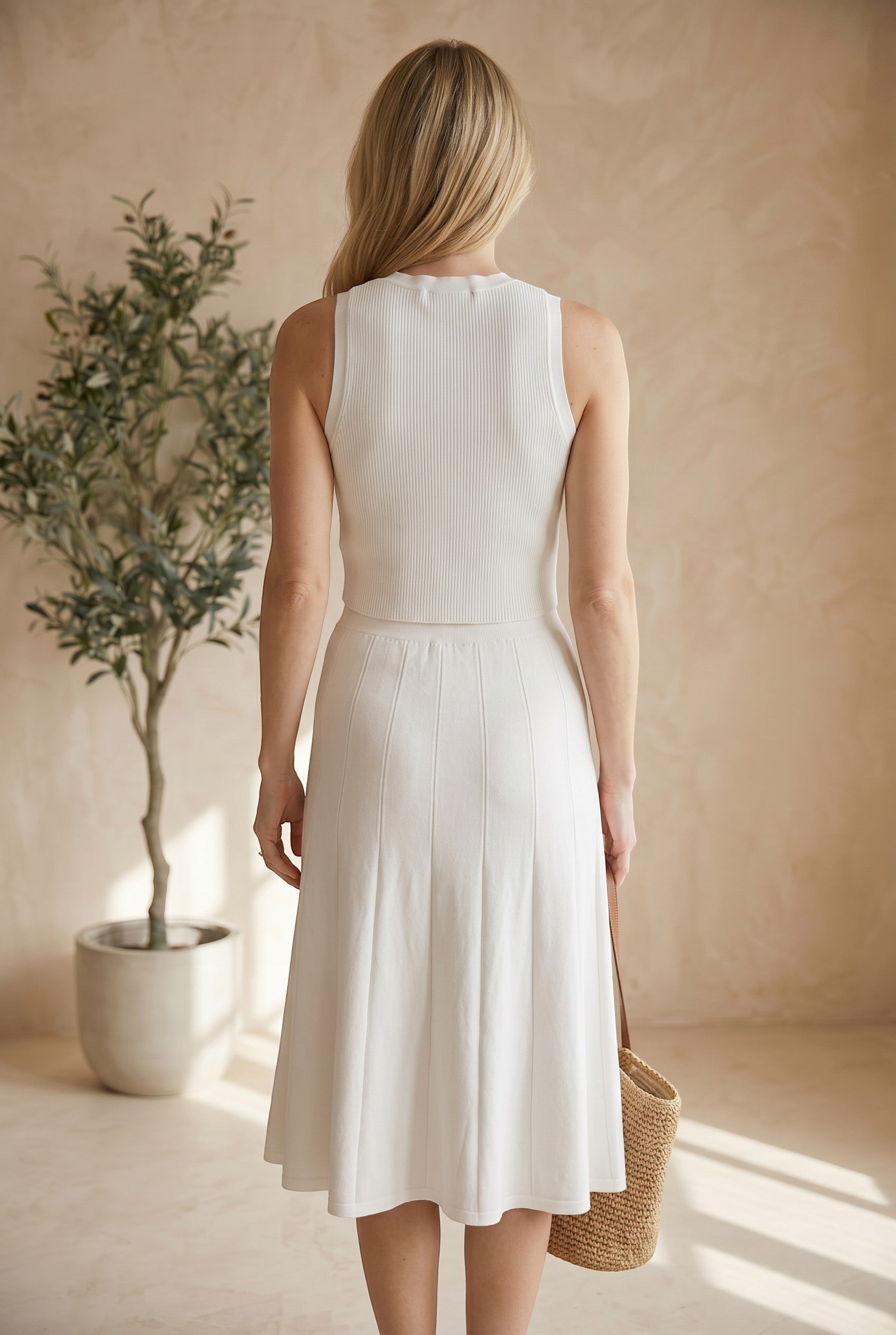 graced white ribbed midi skirt with A-line silhouette and pull-on waistband, made from EcoViscose blend