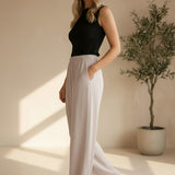 Be Cool beige flowy Tencel wide leg pants with relaxed fit and smooth fabric, shown folded on a flat surface.