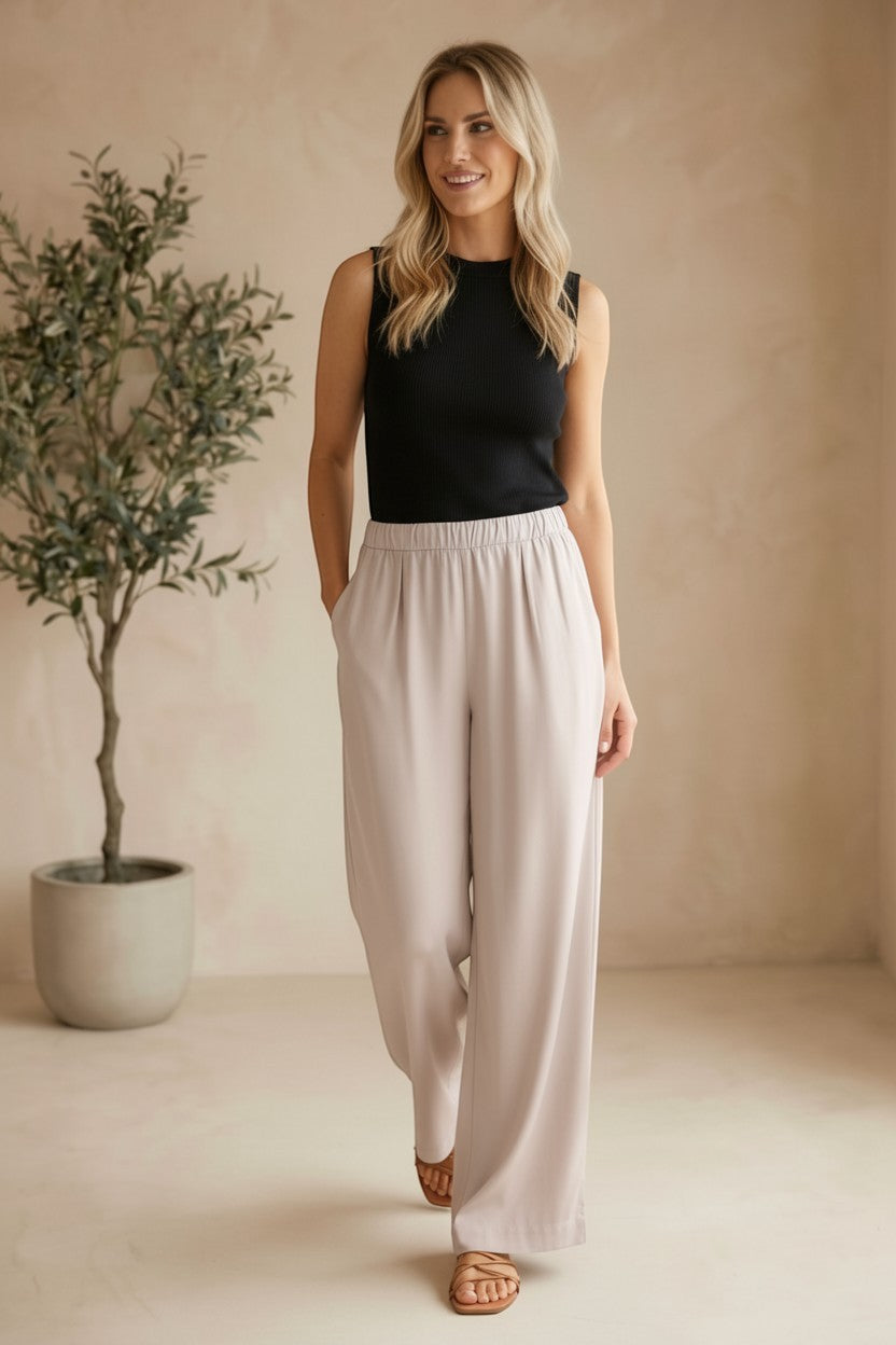 Be Cool beige flowy Tencel wide-leg pants, relaxed fit with draped fabric, high waist, and casual style.