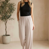 Be Cool beige flowy Tencel wide-leg pants, relaxed fit with draped fabric, high waist, and casual style.