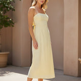 Yellow eyelet tie-back midi dress by Allie Rose, featuring a fitted bodice, flared skirt, and eyelet detailing.