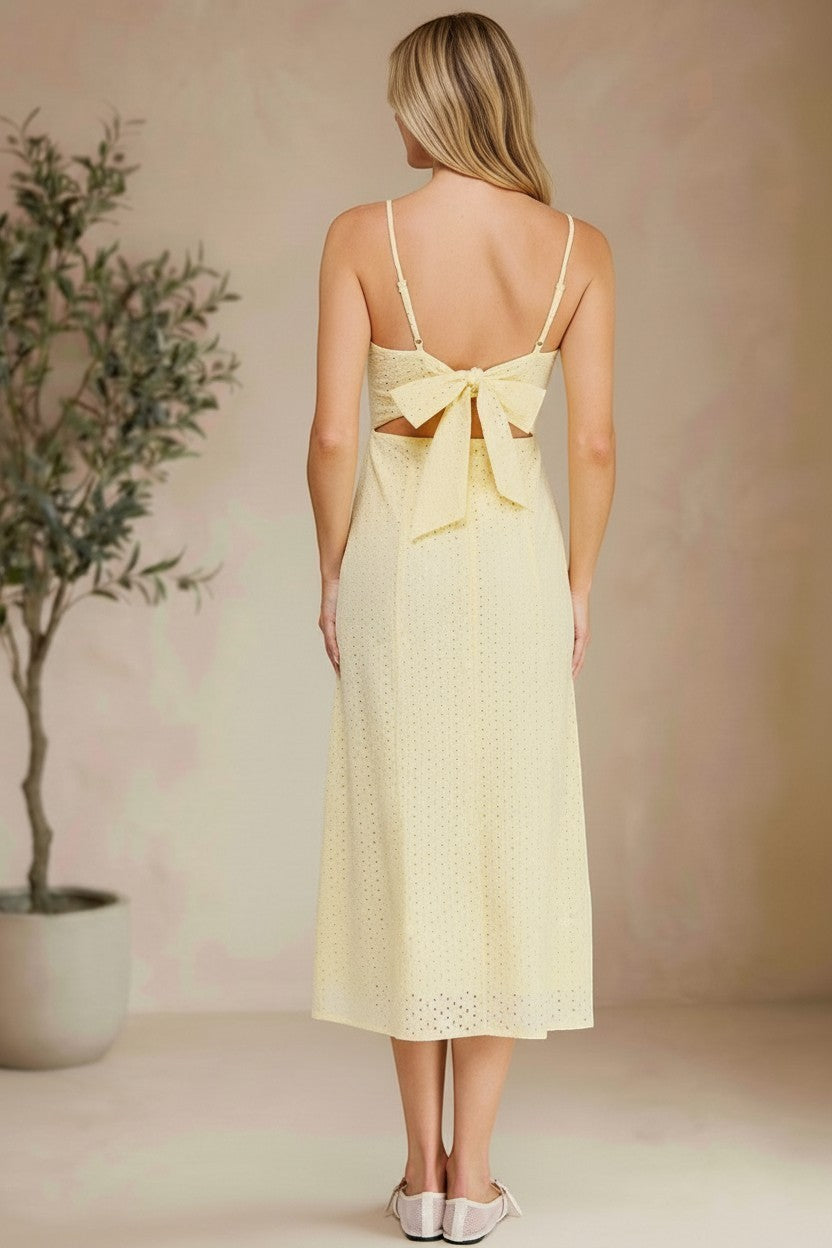 Yellow eyelet tie-back midi dress by Allie Rose, featuring a flattering silhouette and intricate eyelet detailing.