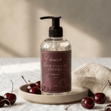Graced Door County Cherry hand soap in an 8 oz bottle, part of bath and body lotions collection, with a cherry scent and elegant label.
