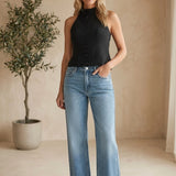 Medium wash high rise full length straight jeans by JBD, shown on a model, with classic five-pocket design and belt loops.