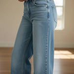 Medium wash JBD high-rise full-length straight jeans, showing the fit and classic style of these denim pants.