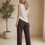 Brown Miou Muse high-rise straight jeans, stylish bottoms with a classic fit, shown on a model.