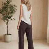 Brown Miou Muse high-rise straight jeans, stylish bottoms with a classic fit, shown on a model.