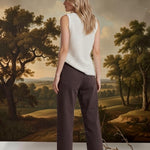 Brown Miou Muse high-rise straight jeans, stylish bottoms with a classic fit, shown on a model.