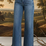 Vervet high-rise wide-leg jeans, stylish bottoms with a relaxed fit, visible in a full-length shot on a plain background.