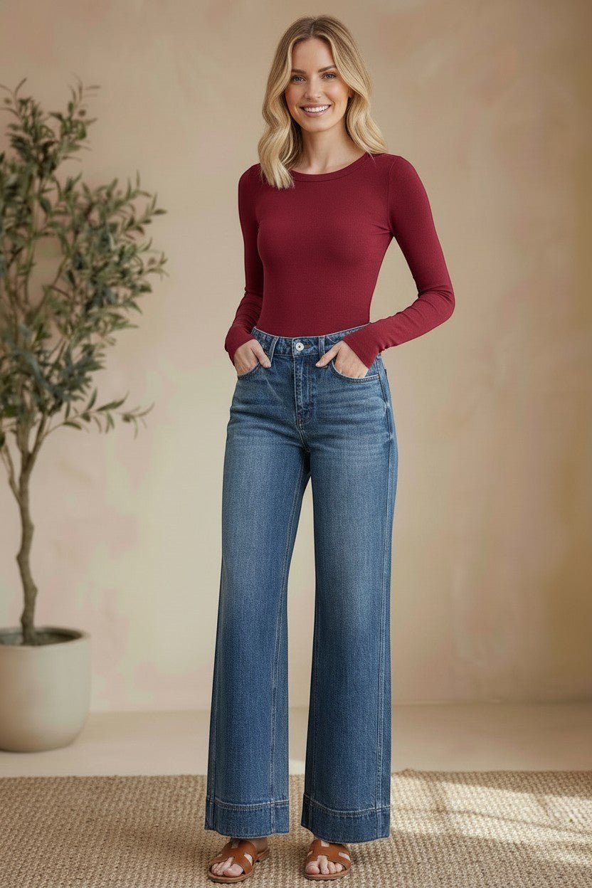 Vervet high-rise wide-leg jeans, stylish bottoms with a relaxed fit, visible in a full-length shot on a plain background.