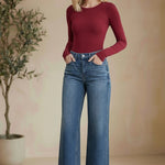 Vervet high-rise wide-leg jeans, stylish bottoms with a relaxed fit, visible in a full-length shot on a plain background.