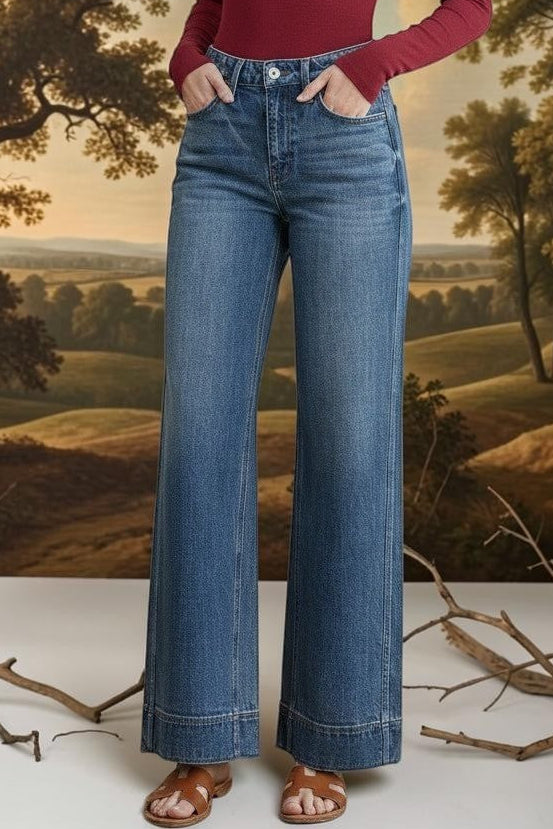 Vervet high-rise wide-leg jeans, stylish bottoms with a relaxed fit, visible in a full-length shot on a plain background.