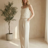 Oatmeal linen trouser pants by in February, casual bottoms with relaxed fit, made from lightweight, breathable linen fabric.