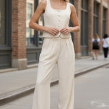 Oatmeal linen button-up top by in february, casual long-sleeve shirt with front buttons and a relaxed fit.