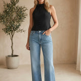 Medium wash high rise full length straight jeans by JBD, shown on a model, with classic five-pocket design and belt loops.