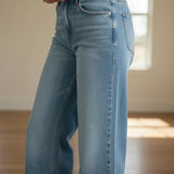 Medium wash JBD high-rise full-length straight jeans, showing the fit and classic style of these denim pants.